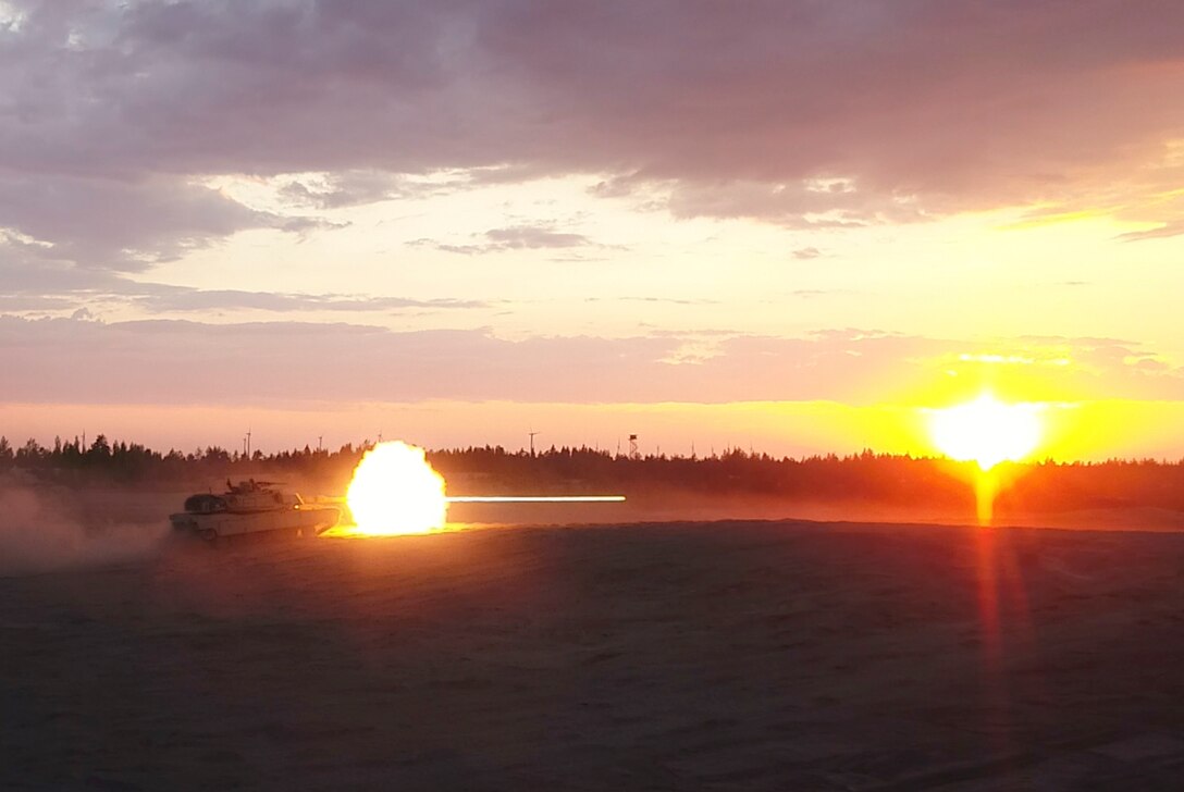 Marines with Bravo Company, 4th Tanks Battalion, fire a M1A1 Abrams tank during a low-light live-fire exercise as part of Exercise Arrow 18 in Pohjankangas Training Area near Kankaanpaa, Finland, May 16, 2018. Exercise Arrow is an annual Finnish multi-national exercise with the purpose of training with mechanized infantry, artillery, and mortar field training skills in a live-fire exercise. This is the first year the Marine Corps is participating in this exercise and the first time the M1A1 Abrams tanks have been in Finland. (U.S. Marine Corps photo by Staff Sgt. Marcin Platek/Released)