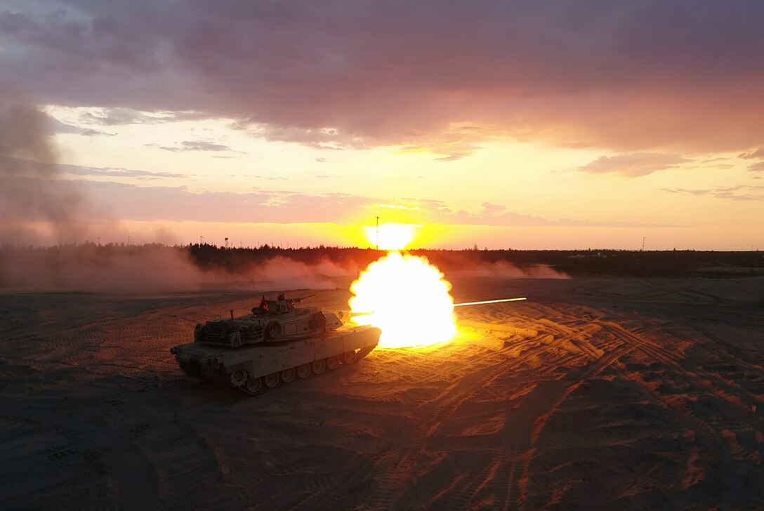 Marines with Bravo Company, 4th Tank Battalion, fire a M1A1 Abrams tank during a low-light live-fire exercise as part of Exercise Arrow 18 in Pohjankangas Training Area near Kankaanpaa, Finland, May 16, 2018. Exercise Arrow is an annual Finnish multi-national exercise with the purpose of training with mechanized infantry, artillery, and mortar field training skills in a live-fire exercise. This is the first year the Marine Corps is participating in this exercise and the first time the M1A1 Abrams tanks have been in Finland. (U.S. Marine Corps photo by Staff Sgt. Marcin Platek/Released)