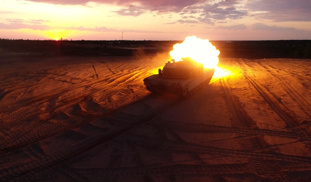 Marines with Bravo Company, 4th Tanks Battalion, fire a M1A1 Abrams tank during a low-light live-fire exercise as part of Exercise Arrow 18 in Pohjankangas Training Area near Kankaanpaa, Finland, May 16, 2018. Exercise Arrow is an annual Finnish multi-national exercise with the purpose of training with mechanized infantry, artillery, and mortar field training skills in a live-fire exercise. This is the first year the Marine Corps is participating in this exercise and the first time the M1A1 Abrams tanks have been in Finland. (U.S. Marine Corps photo by Staff Sgt. Marcin Platek/Released)