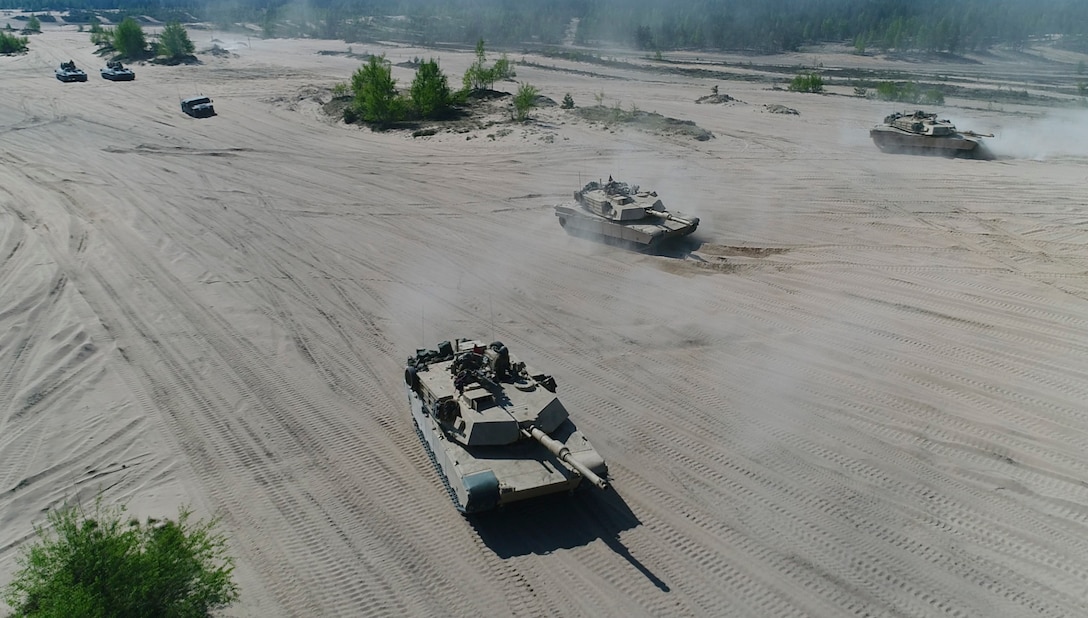 Marines with Bravo Company, 4th Tanks Battalion, drive the M1A1 Abrams tanks during a live-fire exercise as part of Exercise Arrow 18 in Pohjankangas Training Area near Kankaanpaa, Finland, May 16, 2018. Exercise Arrow is an annual Finnish multi-national exercise with the purpose of training with mechanized infantry, artillery, and mortar field training skills in a live-fire exercise. This is the first year the Marine Corps is participating in this exercise and the first time the M1A1 Abrams tanks have been in Finland. (U.S. Marine Corps photo by Staff Sgt. Marcin Platek/Released)