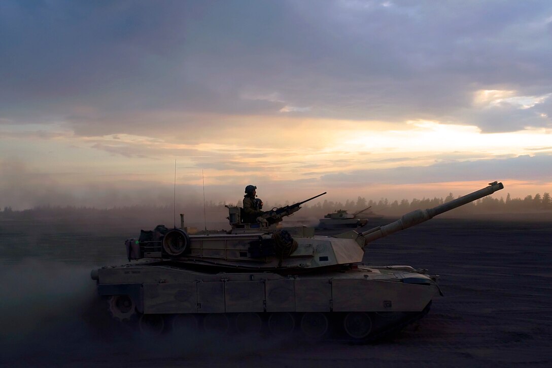 Marines with Bravo Company, 4th Tanks Battalion, prepare to fire a M1A1 Abrams tanks during a low-light live-fire exercise as part of Exercise Arrow 18 in Pohjankangas Training Area near Kankaanpaa, Finland, May 16, 2018. Exercise Arrow is an annual Finnish multi-national exercise with the purpose of training with mechanized infantry, artillery, and mortar field training skills in a live-fire exercise. This is the first year the Marine Corps is participating in this exercise and the first time the M1A1 Abrams tanks have been in Finland. (U.S. Marine Corps photo by Staff Sgt. Marcin Platek/Released)