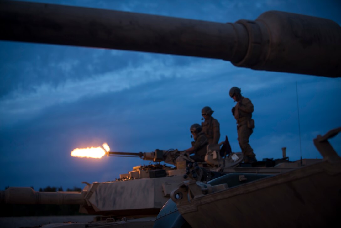 Marines with Bravo Company, 4th Tanks Battalion, fire a 50 cal. machine gun mounted on a M1A1 Abrams tank during Exercise Arrow 18 in Pohjankangas Training Area near Kankaanpaa, Finland, May1 17, 2018. Exercise Arrow is an annual Finnish multi-national exercise with the purpose of training with mechanized infantry, artillery, and mortar field training skills in a live-fire exercise. This is the first year the Marine Corps is participating in this exercise and the first time the M1A1 Abrams tanks have been in Finland. (U.S. Marine Corps photo by Staff Sgt. Marcin Platek/Released)