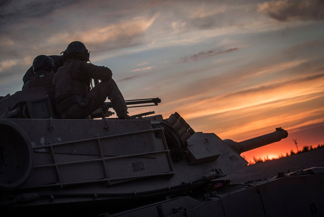 Marines with Bravo Company, 4th Tanks Battalion, prepare to fire a 50 cal. machine gun mounted on a M1A1 Abrams tank during Exercise Arrow 18 in Pohjankangas Training Area near Kankaanpaa, Finland, May 17, 2018. Exercise Arrow is an annual Finnish multi-national exercise with the purpose of training with mechanized infantry, artillery, and mortar field training skills in a live-fire exercise. This is the first year the Marine Corps is participating in this exercise and the first time the M1A1 Abrams tanks have been in Finland. (U.S. Marine Corps photo by Staff Sgt. Marcin Platek/Released)