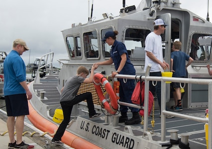 Attendees tour a U.S. Coast Guard cutter during an open house at Coast Guard Sector Charleston, S.C., May 19, 2018, to observe the kickoff for National Safe Boating Week.
