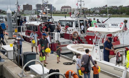Attendees tour U.S. Coast Guard boats, cutters and vessels during an open house at Coast Guard Sector Charleston, S.C., May 19, 2018.