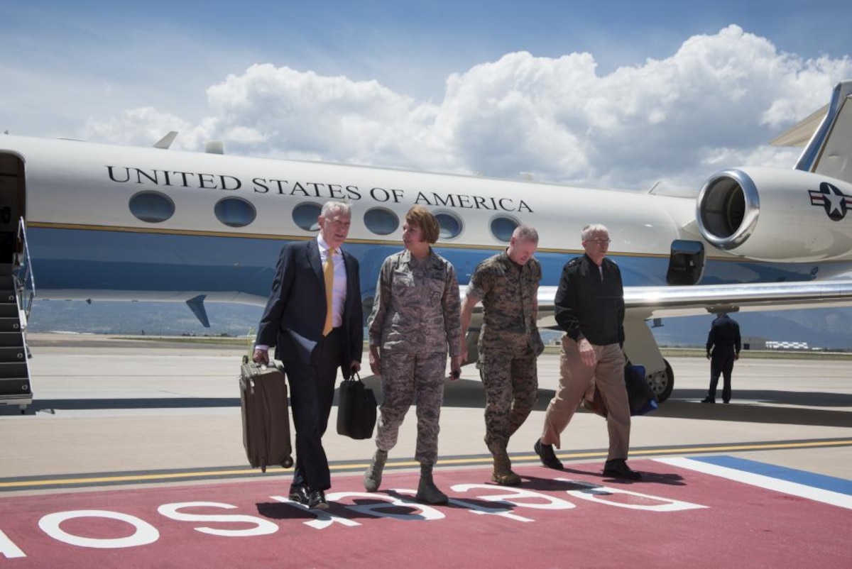 Defense Secretary James N. Mattis walks with Air Force Gen. Lori Robinson at Peterson Air Force Base in Colorado.
