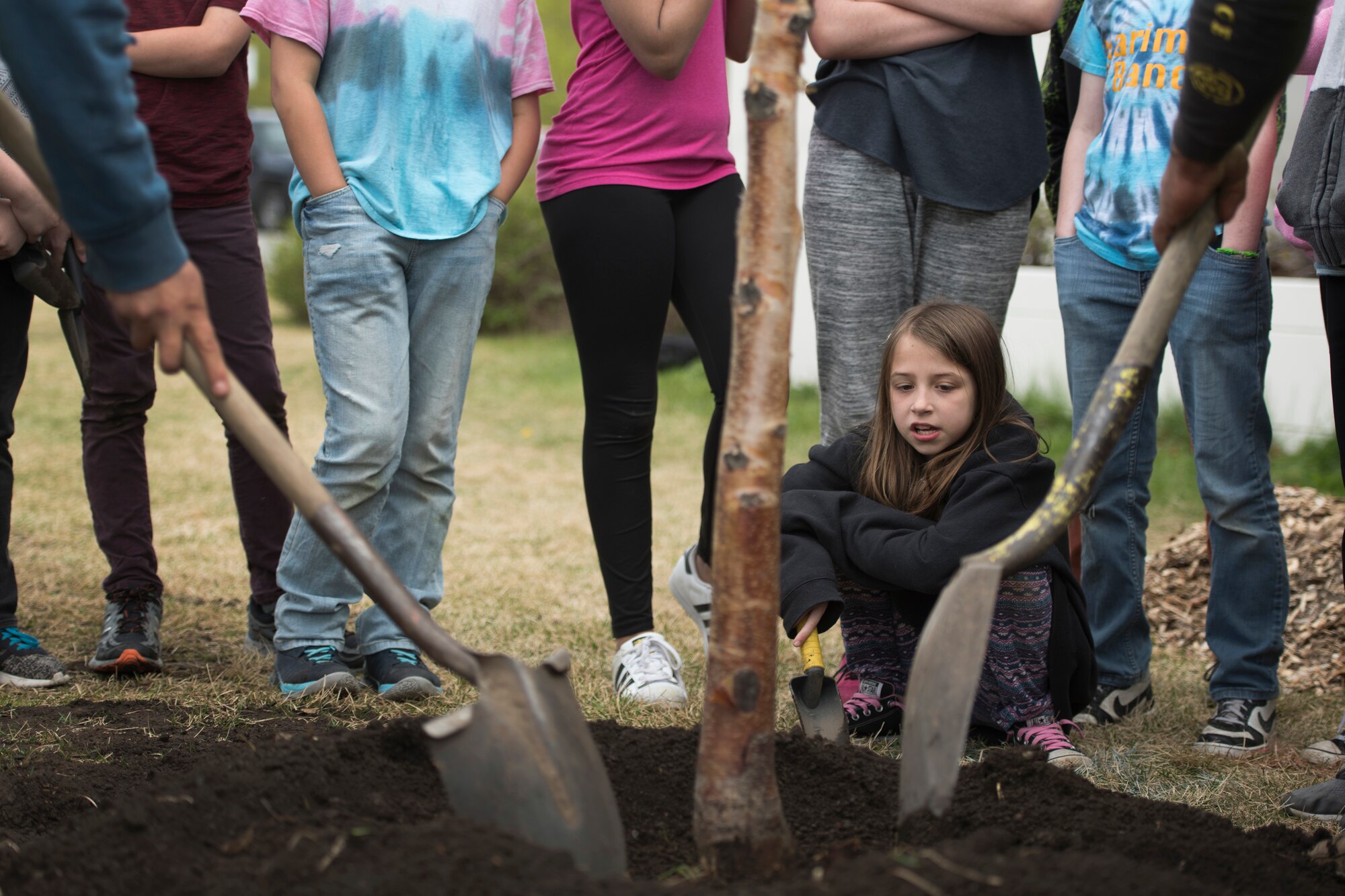 Alberto Cortez and Gerardo Medina, landscape specialists with Faltz Landscaping and Nursery, and Ursa Major Elementary School students shovel soil onto a spruce tree during an Arbor Day ceremony at Joint Base Elmendorf-Richardson, Alaska, May 21, 2018. Ecologists and participants planted two trees at Ursa Major Elementary and the JBER Cache in celebration of Alaska’s Arbor Day, May 17 and 21. National Arbor Day is always celebrated on the last Friday in April, however, Alaska’s Arbor Day is celebrated on the third Monday in May. The Arbor Day Foundation recently named JBER a 2018 Tree City USA, an honor the base has earned for 21 years running.