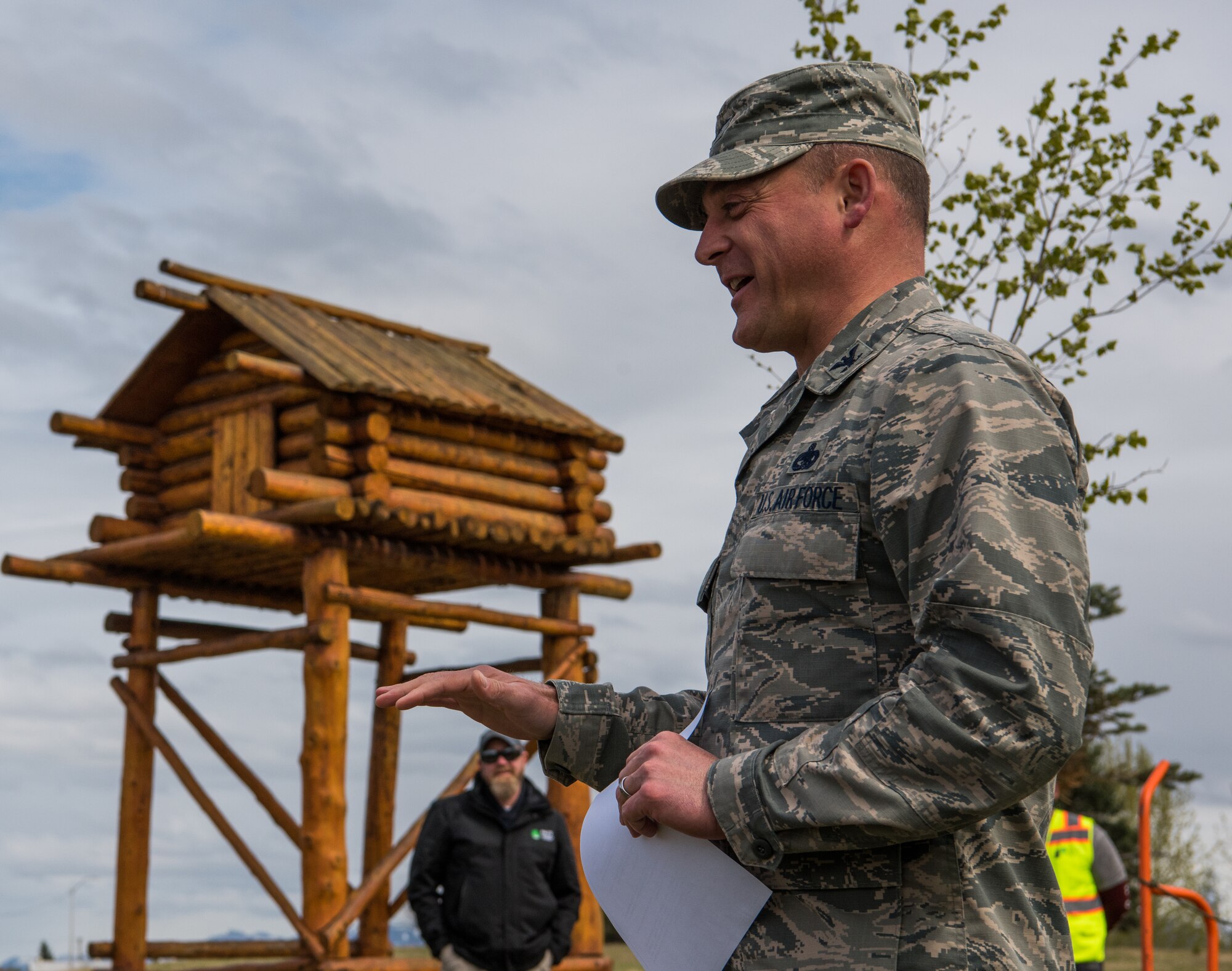 U.S. Air Force Col. George T.M. Dietrich III, 673d Air Base Wing and Joint Base Elmendorf-Richardson commander, speaks to attendees at a tree-planting ceremony at JBER, Alaska, May 17, 2018. The Arbor Day Foundation recently named JBER a 2017 Tree City USA, an honor the base has earned for 21 years running. JBER achieved Tree City USA recognition by meeting four requirements: convening a tree board, instituting a tree-care policy, having an annual forestry budget of at least $2 per capita, and hosting an Arbor Day observance.