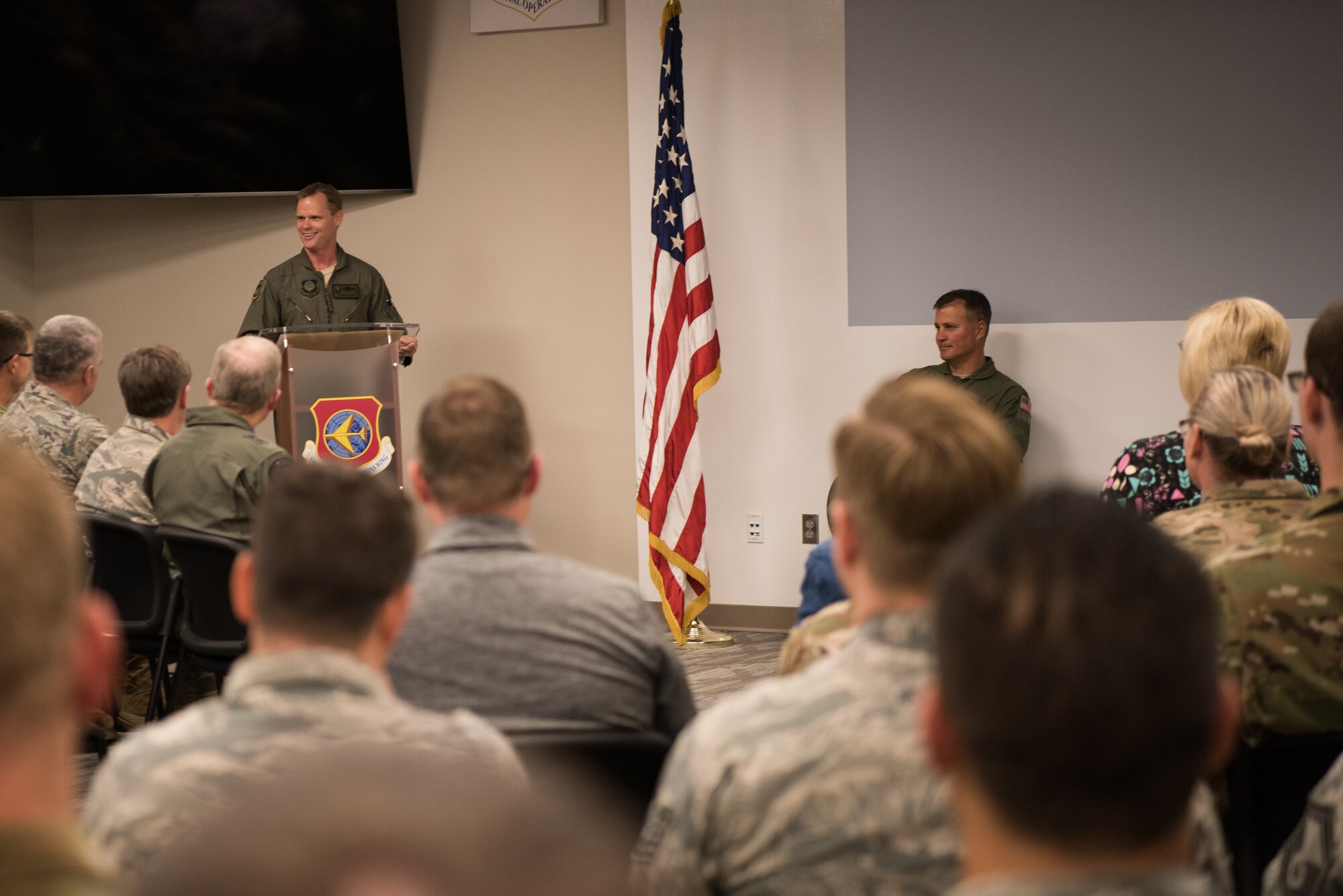 Col. Daniel R. “Pinto” Fowler, incoming 137th Special Operations Group commander (left), speaks to attendees as Col. Devin R. Wooden, 137th Special Operations Wing commander (right), listens during the Group’s change of command ceremony at Will Rogers Air National Guard Base in Oklahoma City, May 17, 2018. Fowler, formerly the Air National Guard's Advisor to U.S. Air Force Special Operations Command, Hurlbert Field, Fla., assumed command with more than 20 years of military experience, including three years as a Joint Terminal Attack Control qualified Air Liaison Officer and 12 years of flying. (U.S. Air National Guard photo by Staff Sgt. Kasey Phipps)