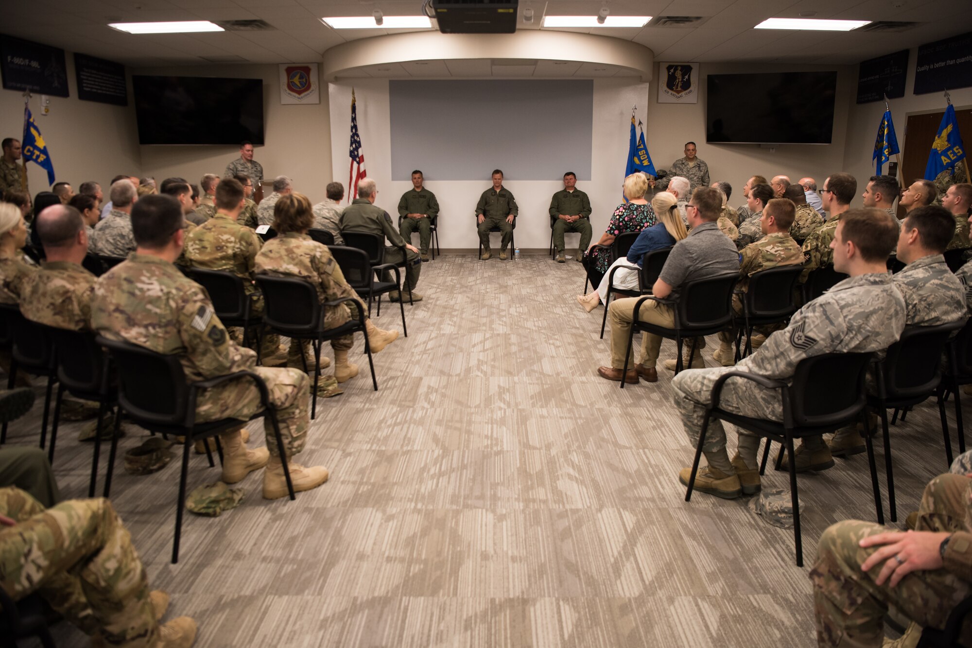 Col. Devin R. Wooden, 137th Special Operations Wing commander (left), Col. Daniel R. “Pinto” Fowler, incoming 137th Special Operations Group commander (center), and Col. Kelly W. Cobble, outgoing 137th Special Operations Group commander (right), sit at the front of the room during the Group’s change of command ceremony at Will Rogers Air National Guard Base in Oklahoma City, May 17, 2018. Fowler, formerly the Air National Guard's Advisor to U.S. Air Force Special Operations Command, Hurlbert Field, Fla., assumed command with more than 20 years of military experience, including three years as a Joint Terminal Attack Control qualified Air Liaison Officer and 12 years of flying. (U.S. Air National Guard photo by Staff Sgt. Kasey Phipps)