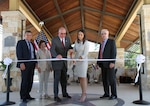 David Coker (third from left), Fisher House Foundation president, and Rachel O’Hern (second from right), Returning Heroes Home executive director, symbolically cut the ribbon re-opening the Freedom Park Amphitheater at Joint Base San Antonio-Fort Sam Houston May 17. The amphitheater, part of the Warrior & Family Support Center, received a 12,000-square-foot canopy addition to shield visitors from the Texas sun. Also pictured (from left) are retired Marine Maj. Gen. (Ret.) Juan Ayala, Director of Military Affairs, City of San Antonio; Barbara Gentry, Fisher House Foundation board member; Coker; O’Hern; and Steve Fogle, Chairman, Board of Directors, Returning Heroes Home. The WFSC serves wounded, injured and ill service members as they receive treatment at Brooke Army Medical Center.
