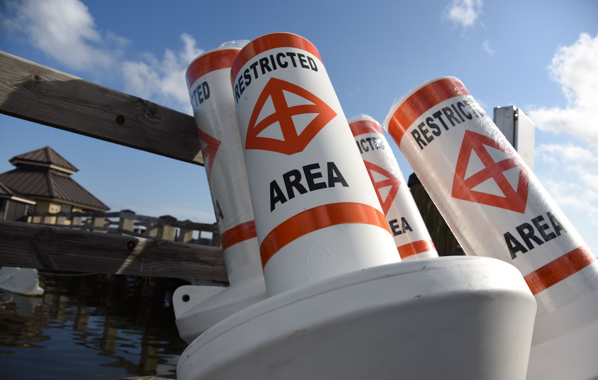 Restricted area buoys are placed on a pier at The Marina at Keesler Air Force Base, Mississippi, May 23, 2018. Keesler and the Department of Marine Resources partnered to install 15 buoys in the Biloxi Back Bay 150 feet from the Keesler shore line as an added base security measure. This project took almost two years of research and coordination with the 81st Security Forces Squadron Anti-terrorism Office, 81st Training Wing Legal Office, the state of Mississippi as well as the Army Corps of Engineers in Washington, D.C. (U.S. Air Force photo by Kemberly Groue)