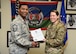 Senior Master Sgt. James Kent, Osan chapter AFSA president, presents Staff Sgt. Roxanne Berg, 607th Air Support Operations Group non-commissioned officer in charge of group intelligence training with a certificate of appreciation at Osan Air Base, republic of Korea, May 18, 2018. Berg is the Legislative trustee of the Osan chapter and won the Air Force Sergeants Association Legislative Award at the division level. (U.S. Air Force photo by Airman 1st Class Ilyana A. Escalona)