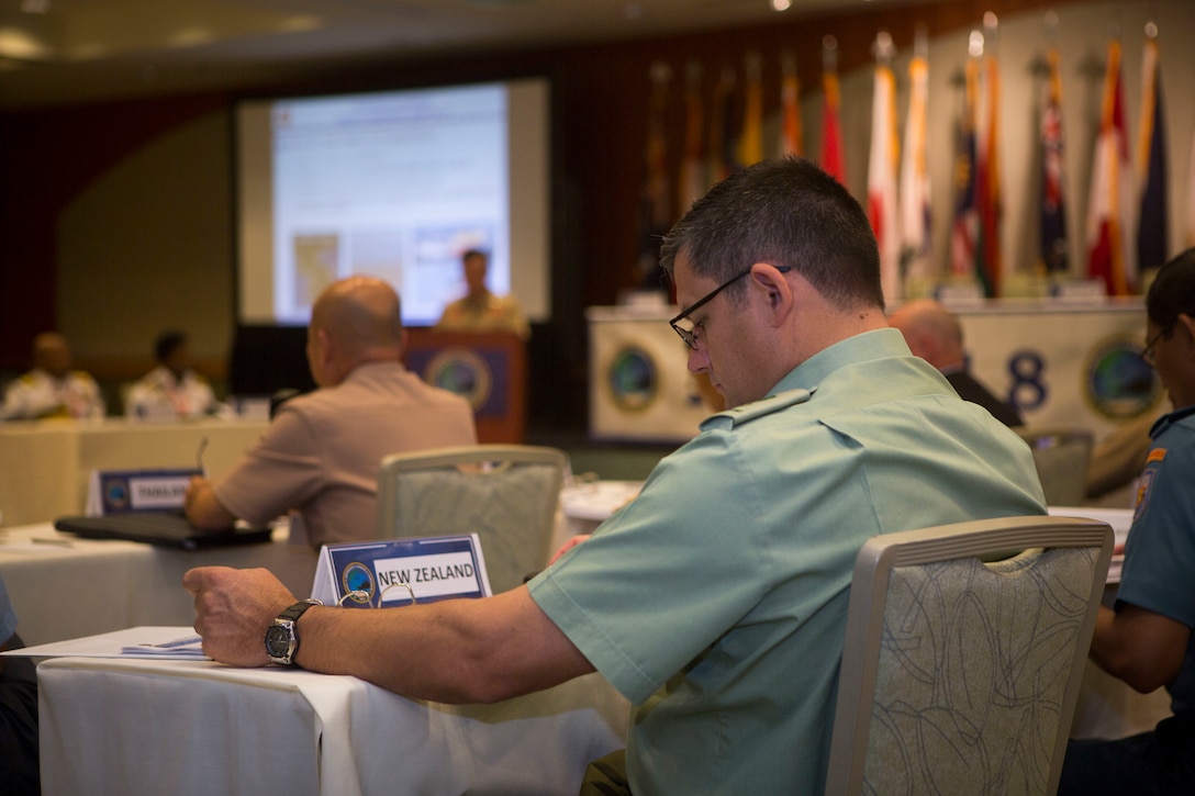 New Zealand Lt. Col. Marcus Linehan, Headquarters Joint Force New Zealand, New Zealand Defence Force, reads his notes during the Pacific Amphibious Leaders Symposium (PALS) 2018 in Honolulu, Hawaii, May 23, 2018. PALS brings together senior leaders of allied and partner militaries with significant interest in the security and stability of the Indo-Pacific region to discuss key aspects of maritime/amphibious operations, capability development, crisis response, and interoperability. (U.S. Marine Corps photo by Sgt. Jonathan E. Lopez Cruet)