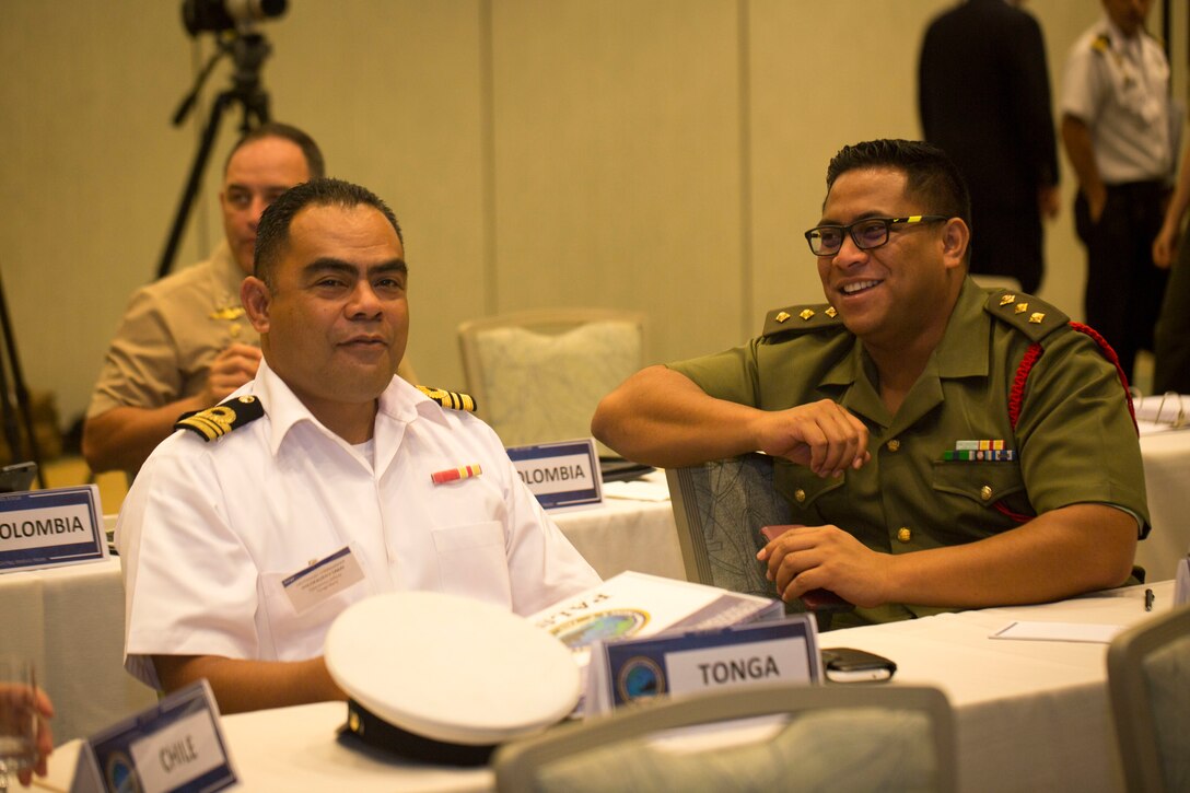Tongan Lt. Cmdr. Holokaukau Lakai, adjutant for his Royal Highness Crown Prince Tupouto’a ‘Ulukalala, His Majesty’s Armed Forces, Kingdom of Tonga and 2nd Lt. Viliami Sione Ngu Takeivulai Tuku’aho, Royal Tongan Marines, participate in the Pacific Amphibious Leaders Symposium 2018 in Honolulu, Hawaii, May 23, 2018. During the symposium, military services from around the world build a closer military-to-military bond with one another. Closer bonds between other militaries facilitate clear lines of communication and foster a spirit of cooperation to meet potential global challenges. (U.S. Marine Corps photo by Sgt. Jonathan E. Lopez Cruet)
