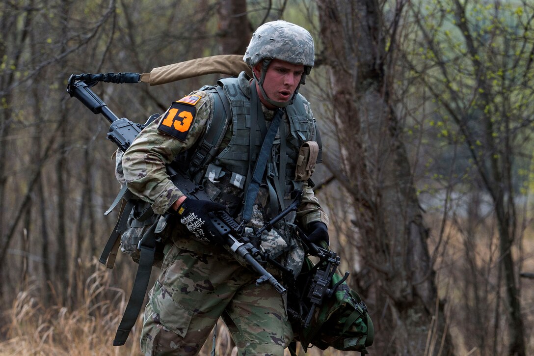 A soldier moves to his next objective during the equipment run event.