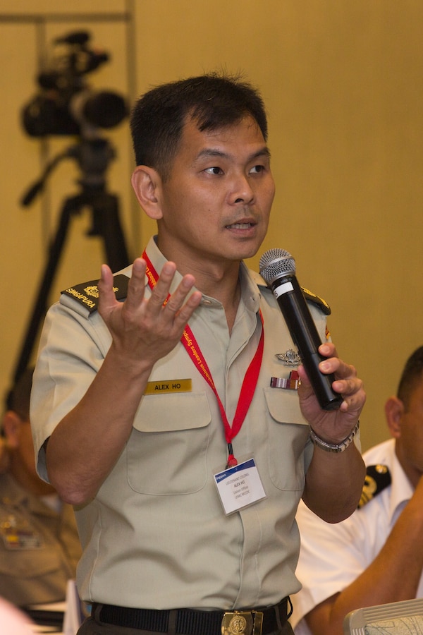 Singapore Army Lt. Col. Alex Ho, liaison officer to the U.S. Marine Corps, asks a question during the Pacific Amphibious Leaders Symposium (PALS) 2018 in Honolulu, Hawaii, May 23, 2018. During the symposium military services from around the world build a closer military-to-military bond with one another. Closer bonds between militaries facilitate clear lines of communication and foster a spirit of cooperation to meet potential global challenges. (U.S. Marine Corps photo by Cpl. Patrick Mahoney)