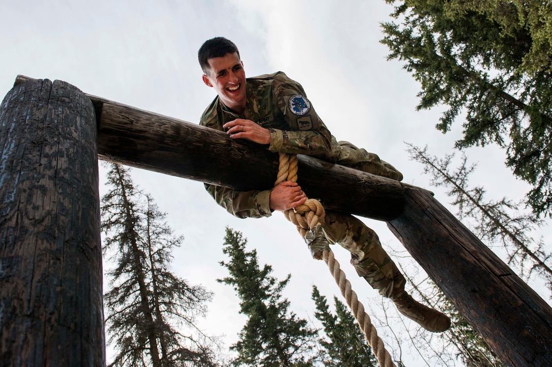 A soldier negotiates an obstacle.