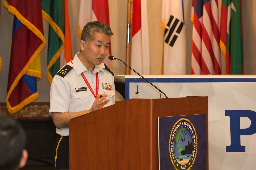 Japan Self Defense Force Col. Yasutaka Matsubara, AAV7 project manager, Project Management Division, Acquisition, Technology & Logistics Agency, provides a brief on Future Amphibious Combat Vehicle Technology during the Pacific Amphibious Leaders Symposium (PALS) 2018 in Honolulu, Hawaii, May 23, 2018. PALS brings together senior leaders of allied and partner militaries with significant interest in the security and stability of the Indo-Pacific region to discuss key aspects of maritime/amphibious operations, capability development, crisis response, and interoperability. (U.S. Marine Corps photo by Cpl. Patrick Mahoney)