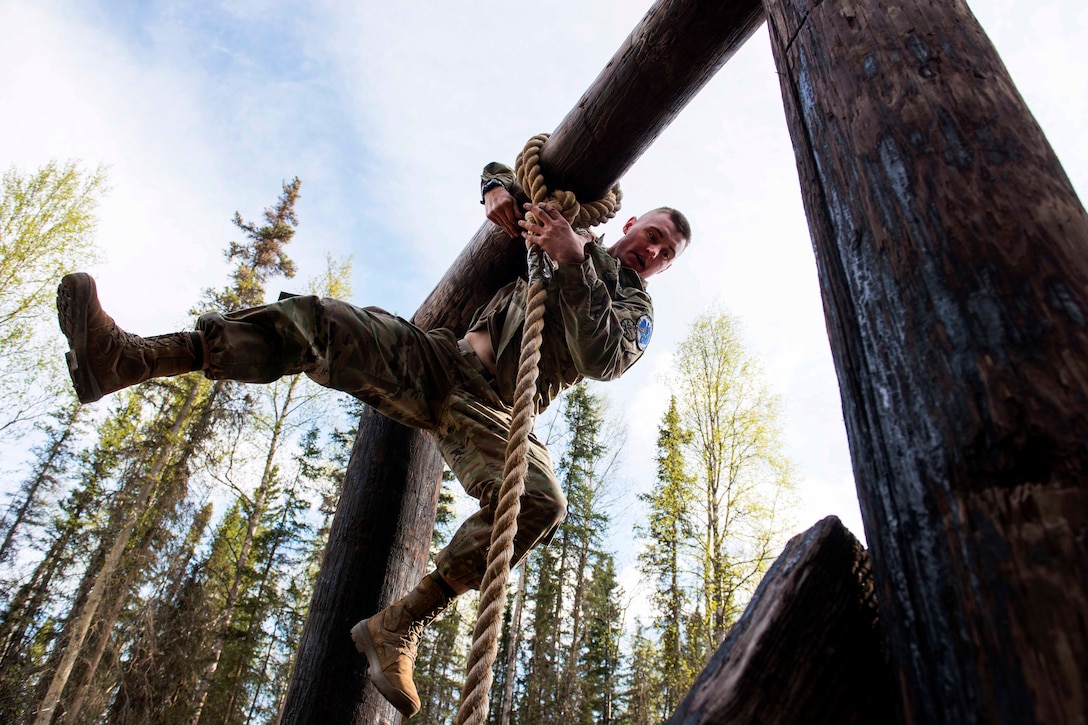 A soldier negotiates an obstacle.