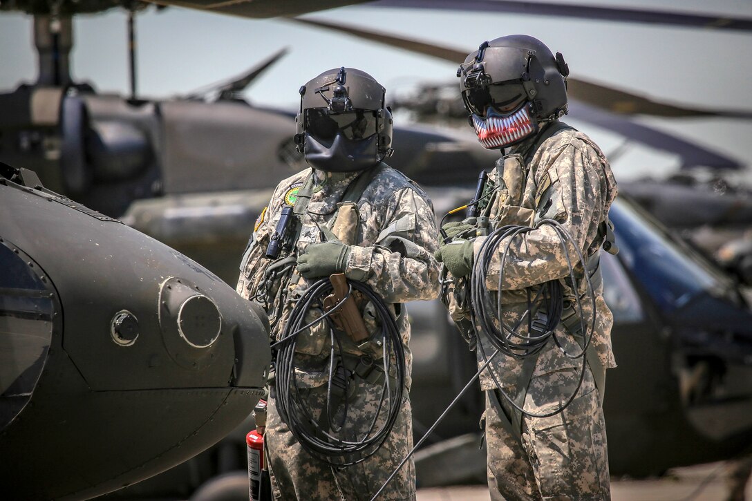 Army crew chiefs check their communications lines in real time.