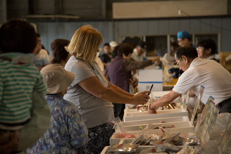 Station residents shop for experience at local wholesale food market