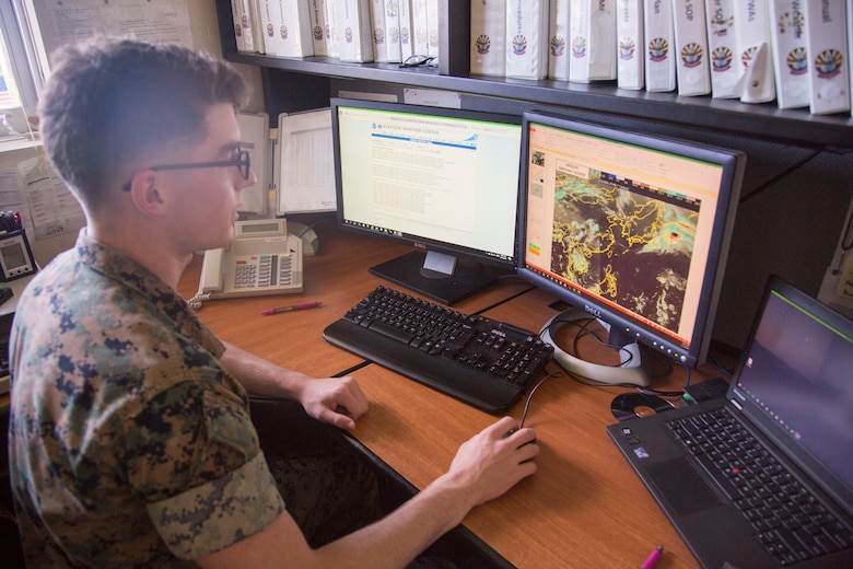MCAS FUTENMA, OKINAWA, Japan – Lance Cpl. Elijah Davis checks the weather reports from other stations in the Asia-Pacific region May 15 aboard Marine Corps Air Station Futenma, Okinawa, Japan.