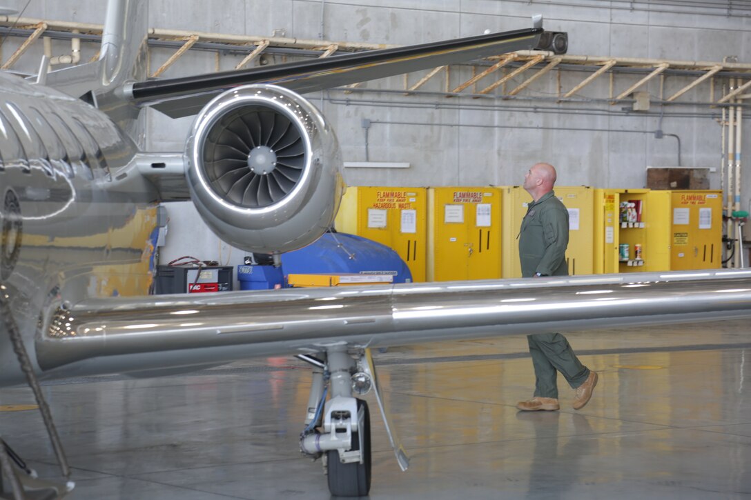 MCAS FUTENMA, OKINAWA, Japan – Maj. Daniel Groeling performs a preflight check of an aircraft May 22 on Marine Corps Air Station Futenma, Okinawa, Japan.