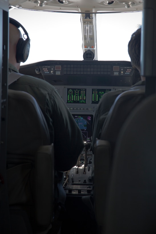 MCAS FUTENMA, OKINAWA, Japan – Pilots sit in the cockpit during a training flight from Marine Corps Air Station Futenma to Yokota Air Base May 22.