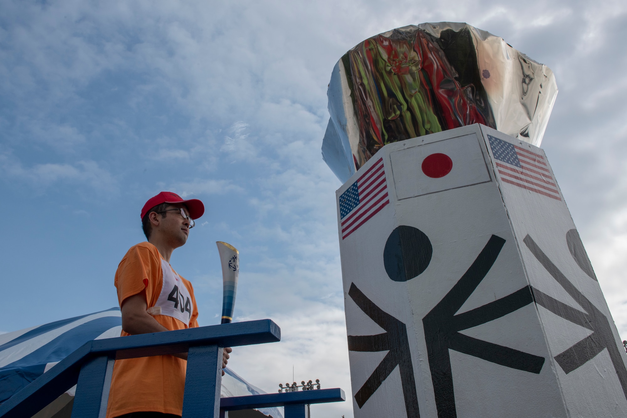 An athlete prepares to the light the torch signifying the beginning of the Kanto Plains Special Olympics at Yokota Air Base, Japan, May 19, 2018.