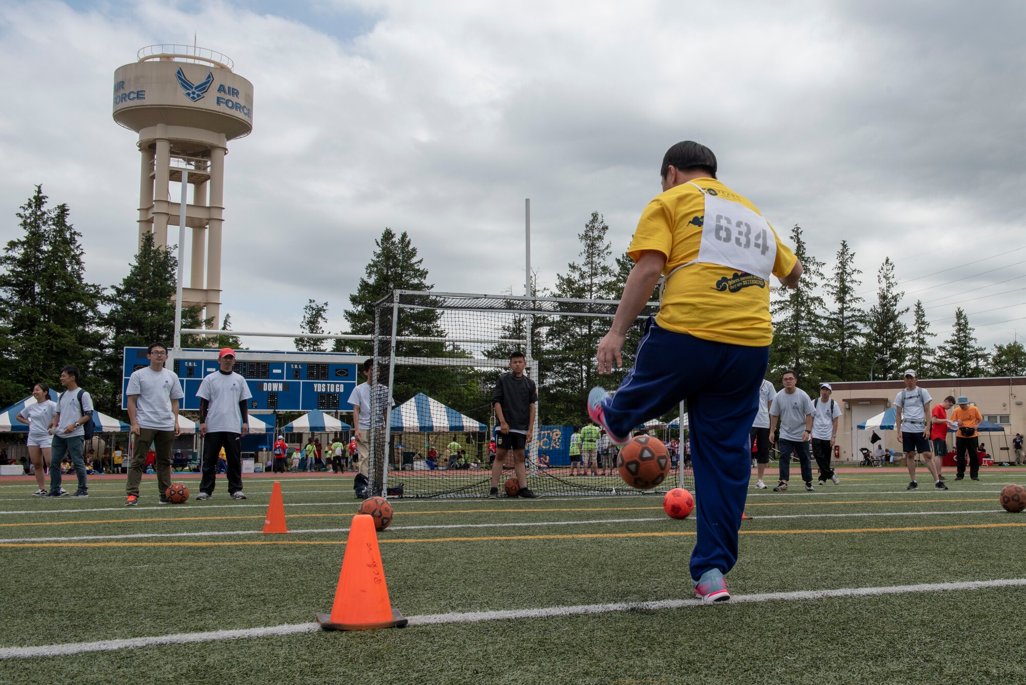 An athlete strikes the ball towards goal during the soccer shoot competition of the Kanto Plains Special Olympics at Yokota Air Base, Japan, May 19, 2018.