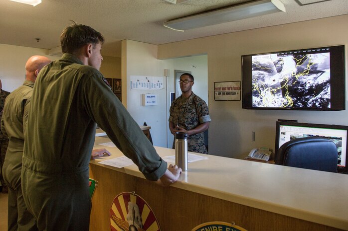 Cpl. Darien Huggins brief pilots on the weather patterns and wind conditions before a training flight May 22 at Marine Corps Air Station Futenma, Okinawa, Japan. Pilots receive a preflight brief that consists of weather and wind patterns for the next 24 hours to help them build a picture of any challenges they may face in the air.  Huggins is a meteorology and oceanology analyst forecaster with Headquarter and Headquarter Support, MCAS Futenma.