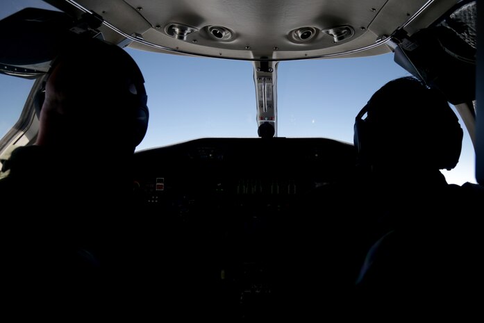Pilots sit in the cockpit during a training flight from Marine Corps Air Station Futenma to Yokota Air Base May 22, 2018. Training flights are a way for Marine pilots to get flight hours to help maintain their proficiency. They are also used to prepare pilots to fly in harsher weather, if needed.