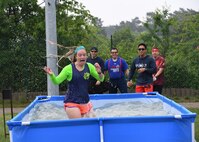 A 1st Combat Communications Squadron Airman walks through a pool of water during the 2018 Ramstein Mudder, May 24 at Ramstein Air Base, Germany. This is the fifth year the 86th Airlift Wing has hosted the obstacle course for their annual resilience day. (U.S. Air Force photo by Staff Sgt. Nesha Humes Stanton)