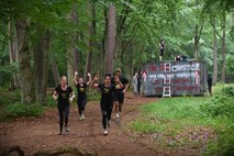 Kaiserslautern Military Community members run an obstacle course during the 2018 Ramstein Mudder, May 24 at Ramstein Air Base, Germany. The purpose of the mudder was to promote camaraderie during the 86th Airlift Wing’s resilience day. (U.S. Air Force photo by Staff Sgt. Nesha Humes Stanton)