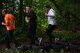 Kaiserslautern Military Community members run through tires during the 2018 Ramstein Mudder, May 24 at Ramstein Air Base, Germany. The fifth annual mudder included 16 stations such as a balance beam, wall climb, low crawl, tire flip and an ammo can relay. (U.S. Air Force photo by Staff Sgt. Nesha Humes Stanton)