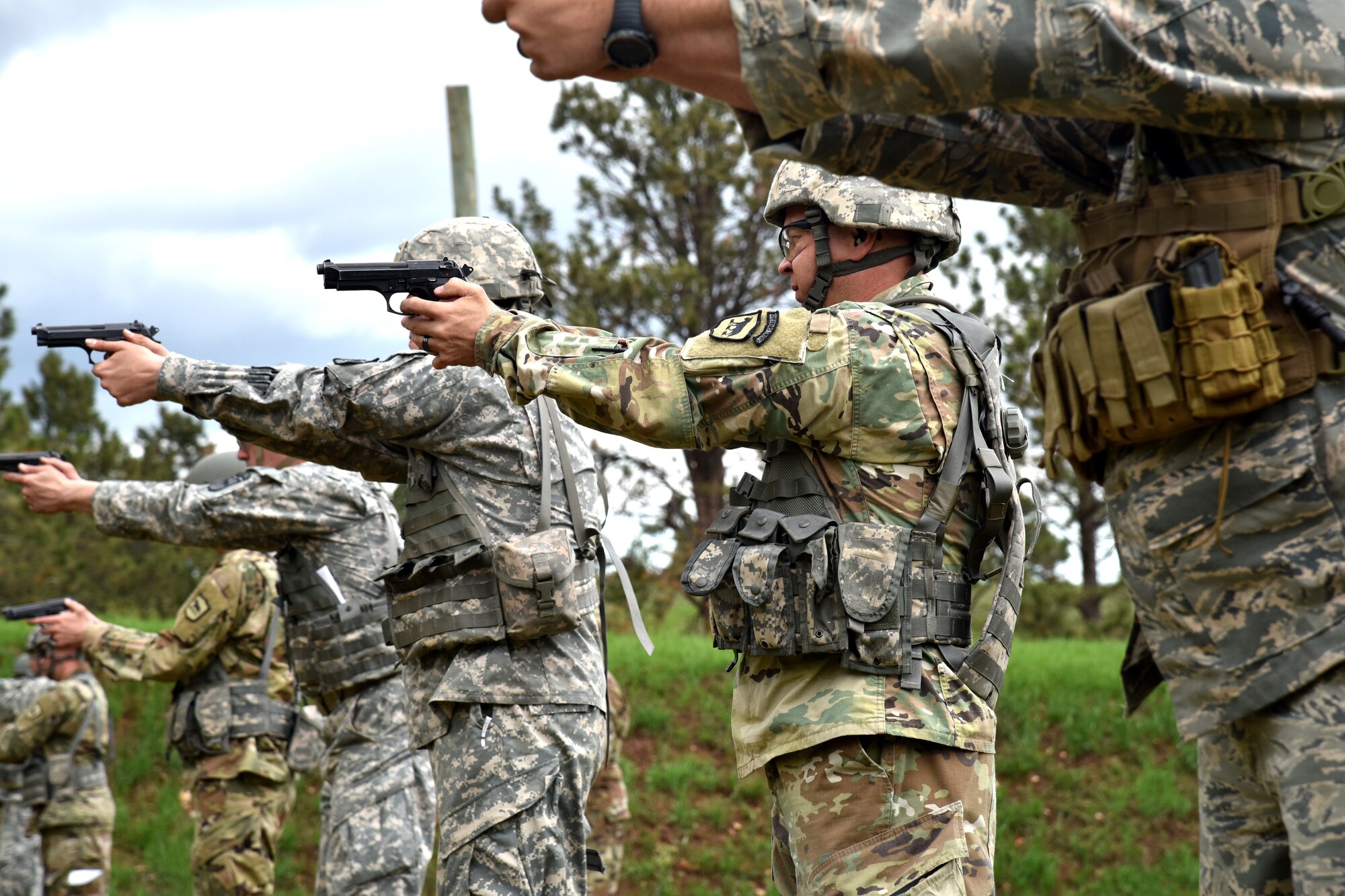 Members of the South Dakota National Guard compete in The State Command Sergeant Major’s Outdoor Match with an M-9 pistol May 18, 2018 at Camp Rapid, S.D.