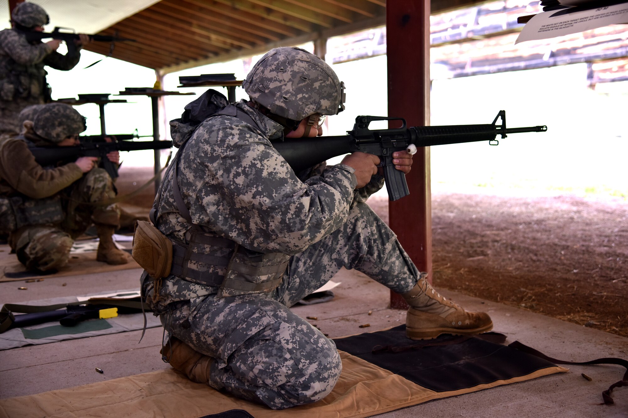 Specialist T.J. Carpenter, 139th Brigade Support Battalion religious affairs specialist, shoots an M-16 rifle from the kneeling position during The State Command Sergeant Major’s Outdoor Match May 19, 2018 at Camp Rapid, S.D.