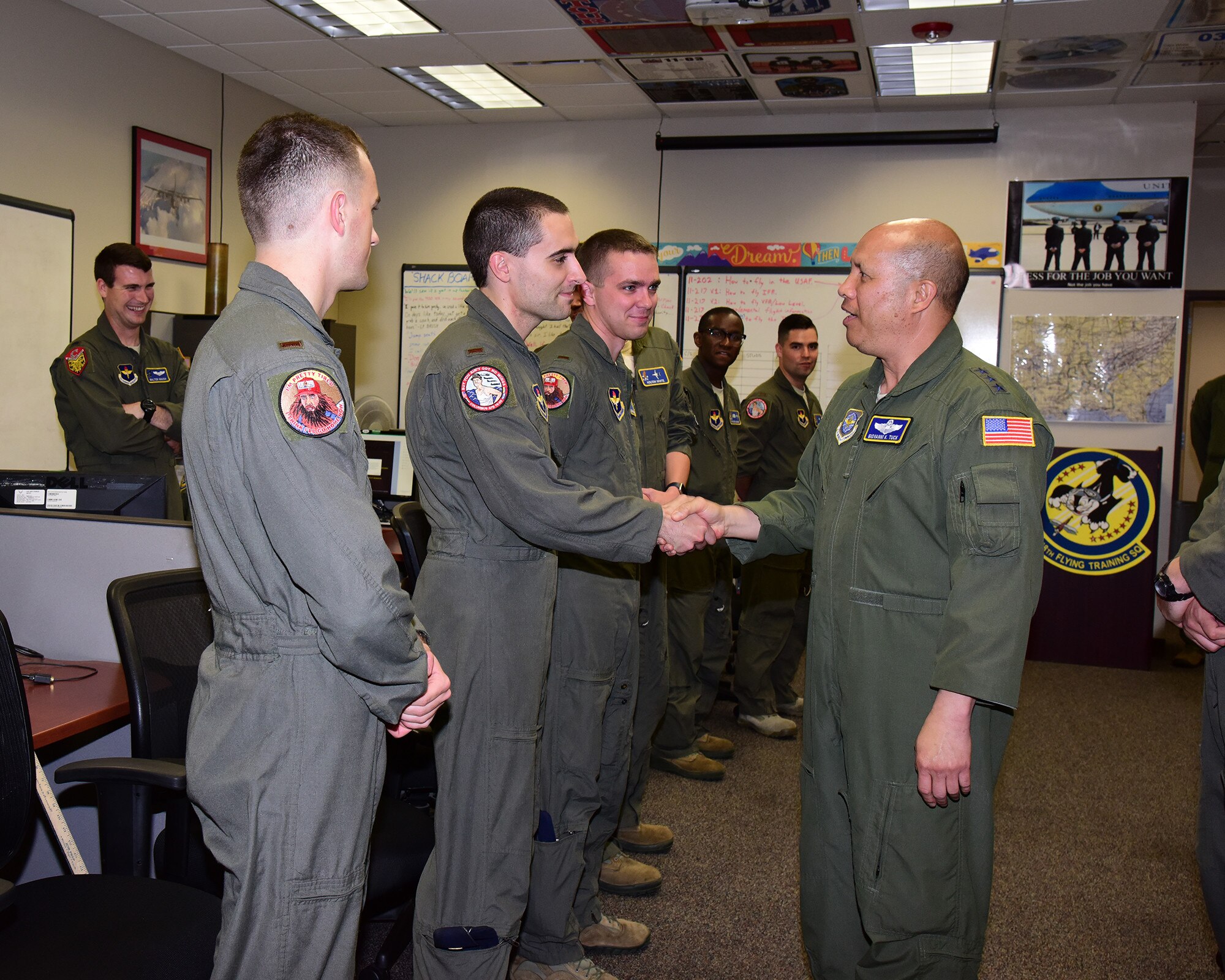 Lt. Gen. GI Tuck, 18th Air Force commander, speaks with student pilots in the 48th Flying Training Squadron May 17, 2018, on Columbus Air Force Base, Mississippi. Tuck went around Columbus AFB to see the pilot training mission before speaking at Specialized Undergraduate Pilot Training Class 18-09’s graduation ceremony May 18. (U.S. Air Force photo by Elizabeth Owens)