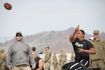 Soldier in civilian clothes competes in field event.