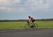 Capt. Hunter Barnhill, 37th Flying Training Squadron instructor pilot, trains on his road bike May 15, 2018, on Columbus Air Force Base, Mississippi. Barnhill will bike anywhere from a few miles to over 15 miles in one training session. As a member of the Air Force Wounded Warrior program he is preparing for the 2018 Warrior Games June 1-9 at the U.S. Air Force Academy in Colorado Springs, Colorado. (U.S. Air Force photo by Airman 1st Class Keith Holcomb)