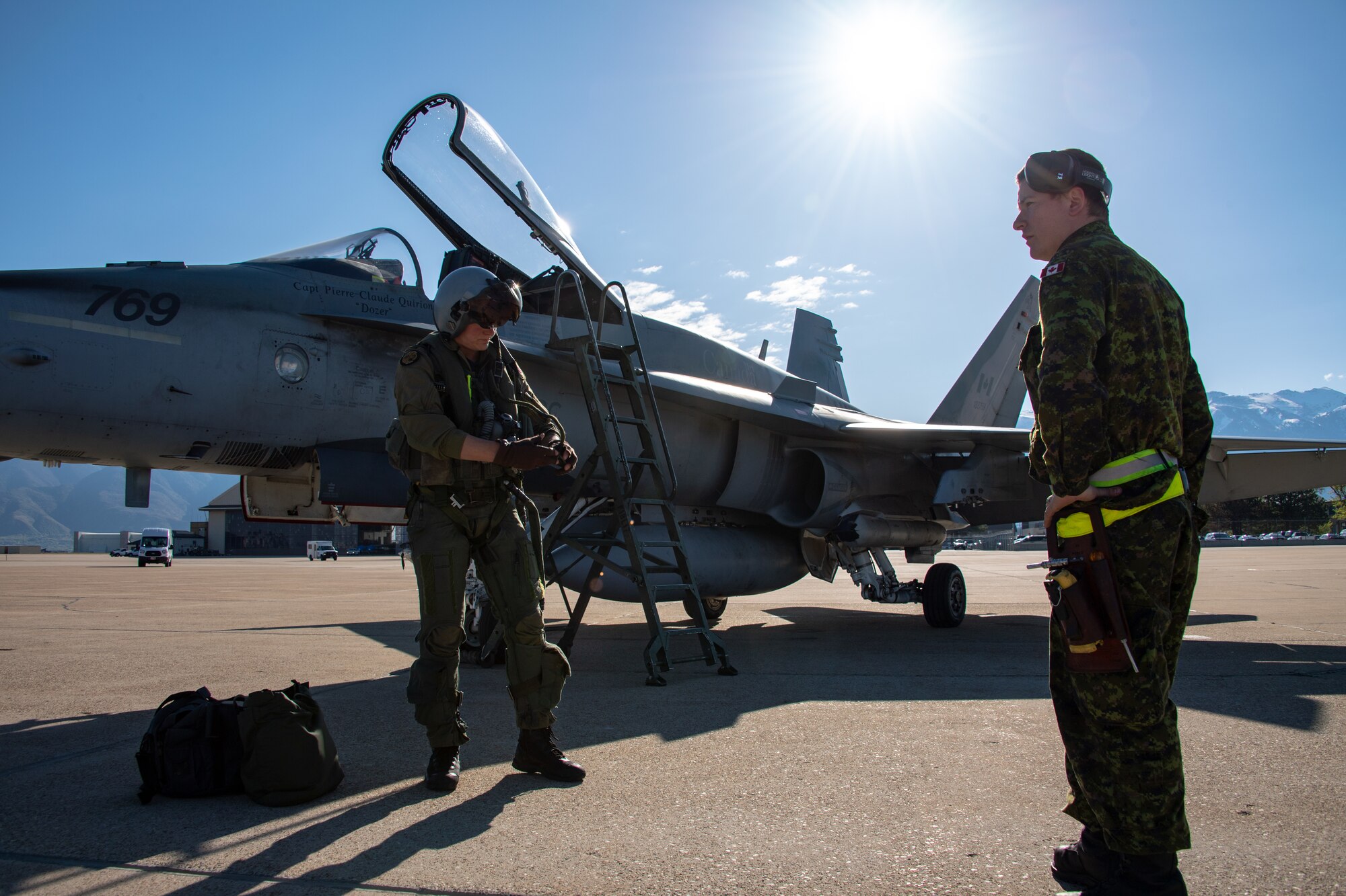 Royal Canadian Air Force pilot Capt. Jason Berndt and structural technician Cpl. Matthew Roy, assigned to the 433rd Tactical Fighter Squadron, perform pre-flight checks May 3, 2018, at Hill Air Force Base, Utah. The Canadian unit participated in a Weapons Evaluation Systems Program, or WSEP, exercise conducted by the 86th Fighter Weapons Squadron, a Hill tenant unit. (U.S. Air Force photo by R. Nial Bradshaw)