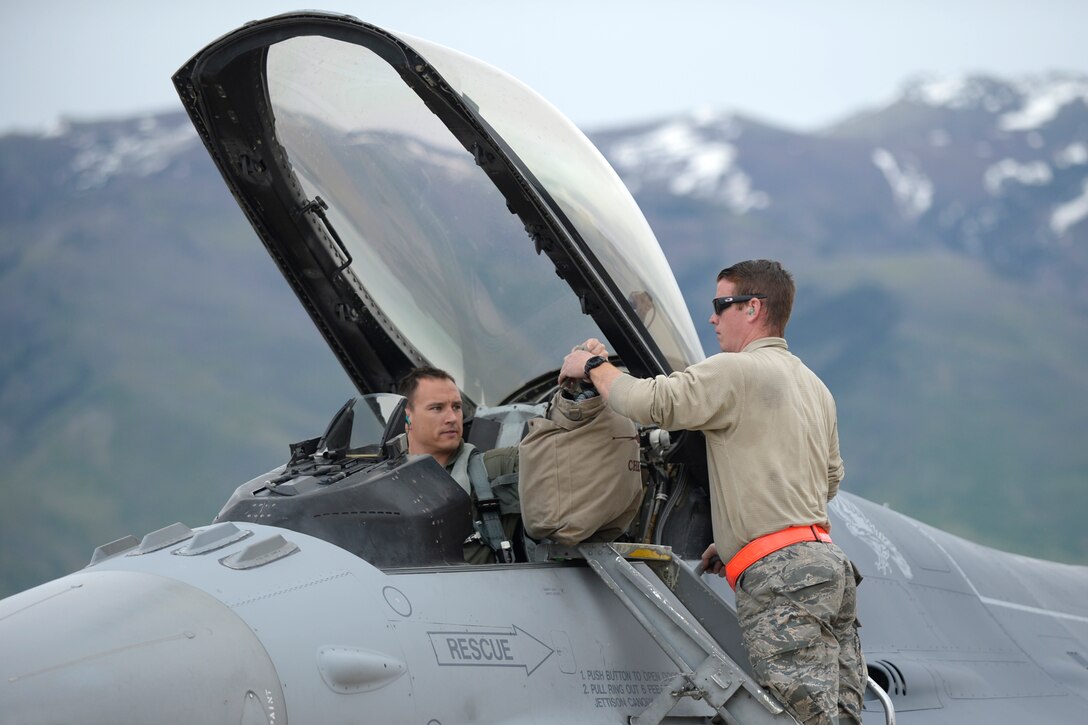 Staff Sgt. Jeremy Andrews, 79th Fighter Squadron, provides recovery support to Major Brian Lewis, “Chewy”, after returning from an F-16 training mission, May 10, 2018, at Hill Air Force Base, Utah. The unit from Shaw Air Force Base, South Carolina, participated in a Weapons System Evaluation Program, or WSEP, exercise conducted by the 86th Fighter Weapons Squadron, a Hill tenant unit. (U.S. Air Force photo by Todd Cromar)
