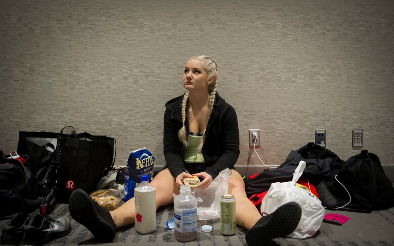 Staff Sgt. Bailey Jewell, a compliance assessor with the National Air and Space Intelligence Center Inspector General’s office, eats after weighing in during the Arnold Sports Festival March 1, 2018 at the Greater Columbus Convention Center in Columbus, Ohio. The festival featured 77 sports, including Olympic Weightlifting where Jewell competed. (U.S. Air Force photo/Senior Airman Jonathan Stefanko)