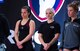 Staff Sgt. Bailey Jewell, center, a compliance assessor with the National Air and Space Intelligence Center Inspector General’s office, stands on stage alongside her competition during the Arnold Sports Festival March 1, 2018 at the Greater Columbus Convention Center in Columbus, Ohio. More than 22,000 athletes from 80 nations attended the festival to compete across 77 sports. (U.S. Air Force photo/Senior Airman Jonathan Stefanko)