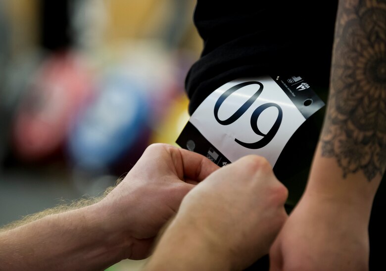 Staff Sgt. Bailey Jewell, a compliance assessor with the National Air and Space Intelligence Center Inspector General’s office, receives her number before participating in the Olympic Weightlifting competition March 1, 2018 at the Greater Columbus Convention Center in Columbus, Ohio. The competition was part of the annual Arnold Sports Festival where more than 22,000 athletes from 80 nations attended the festival to compete across 77 sports. (U.S. Air Force photo/Senior Airman Jonathan Stefanko)