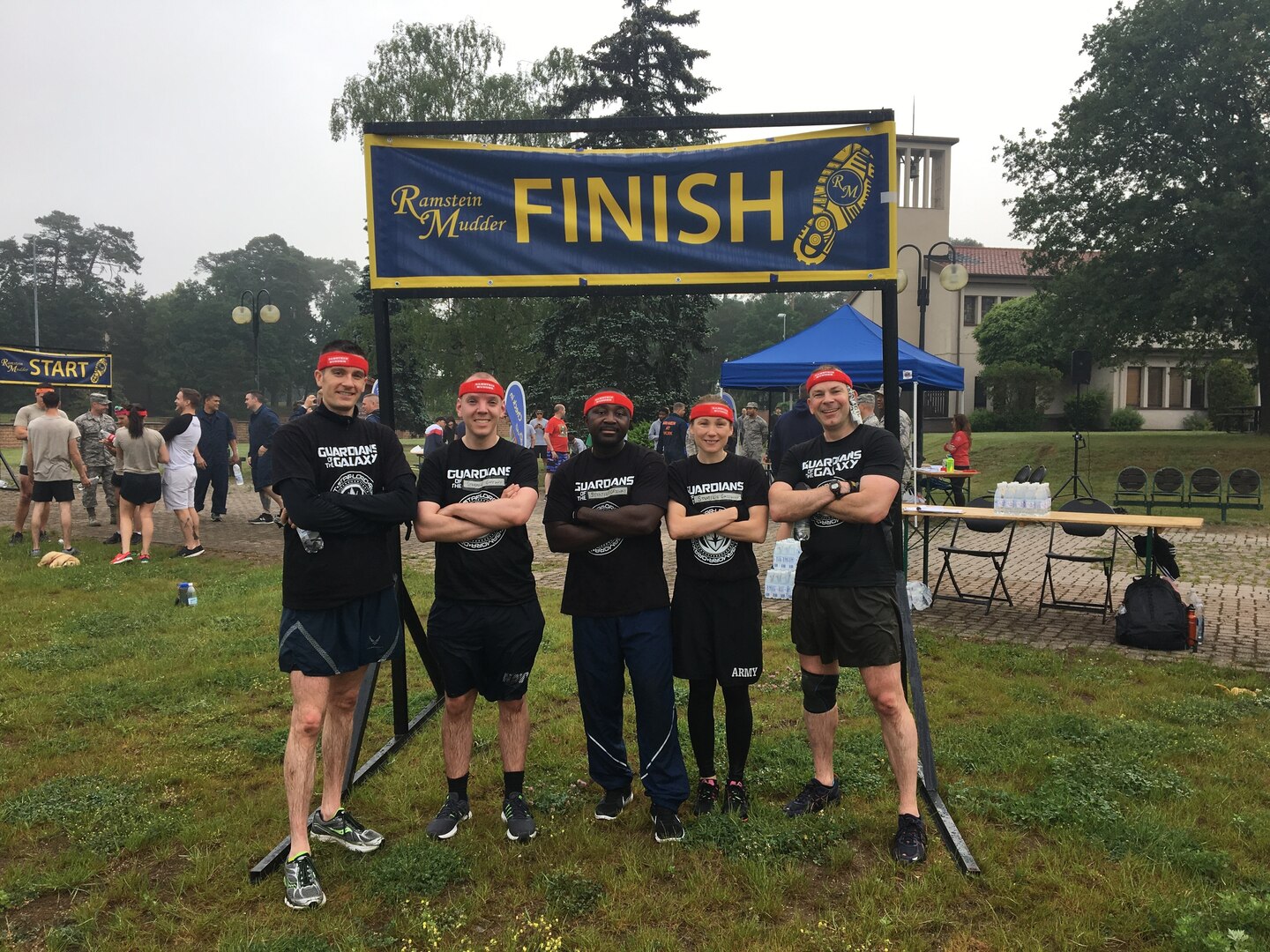 From left: Air Force Maj. Brian Jorgensen, Navy Lt. Brent Cohen, Air Force Master Sgt. Thomas Baah, Army Maj. Tracy Yates and Marine Lt. Col. Ian Galbraith relax after completing the event. Courtesy photo