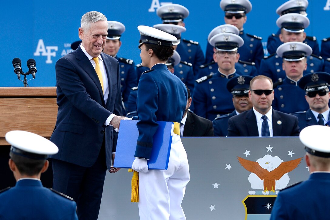 Defense Secretary James N. Mattis shakes hands with a graduating Air Force cadet.