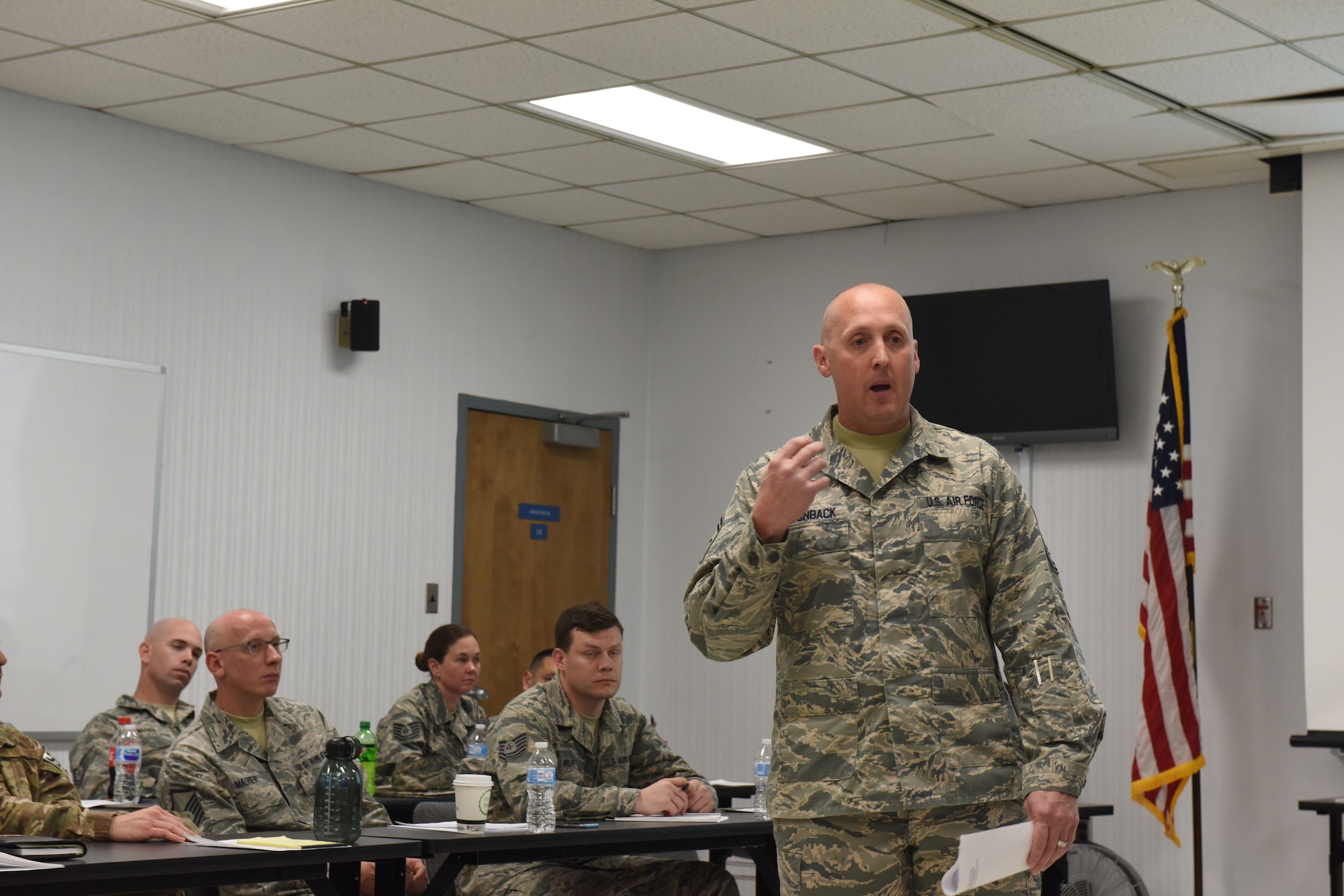 Master Sgt. Dana Pyles, 193rd Mission Support Group first sergeant, listens to Master Sgt. Jose Santiago, 193rd Special Operations Maintenance Group first sergeant, Lt Col Eric McKissick SOMXG deputy group commander, and Chief Master Sgt. Robert Smith, Special Operations Aircraft Maintenance Squadron superintendent talk about the importance of the leadership triad and how they handle issues as a triad, during a 2-day additional duty first sergeant seminar May 1-2, 2018, Middletown, Pennsylvania. The seminar was hosted by 193rd SOW first sergeant council and most briefings were taught by Air Force First Sergeant Academy instructors. (U.S. Air Force Photo by Master Sgt. Culeen Shaffer/Released)