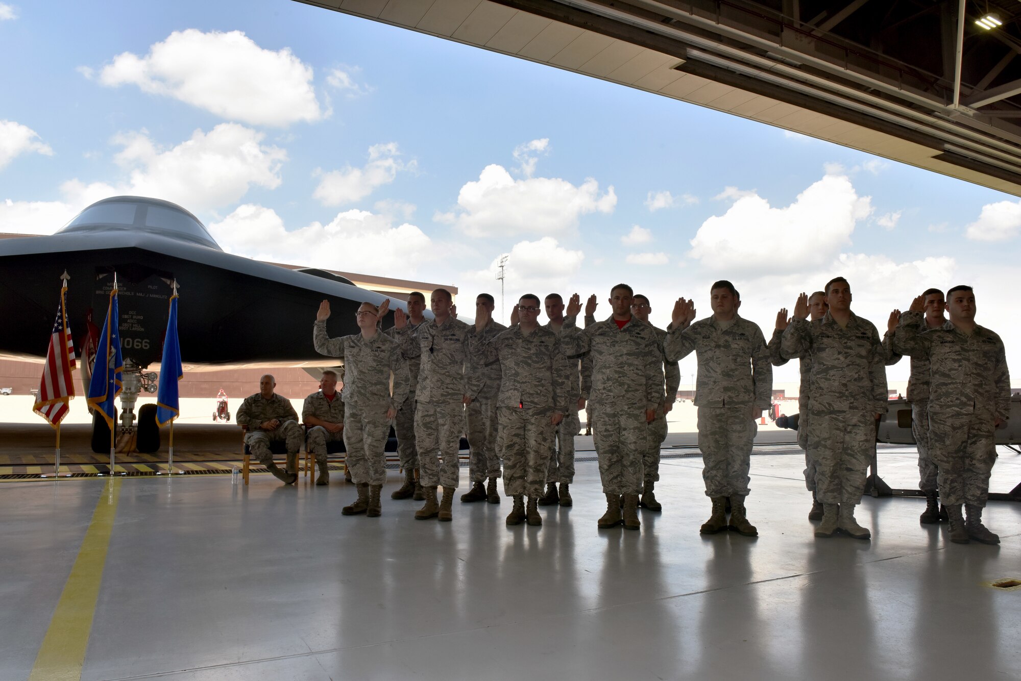 Whiteman's newest dedicated  crew chiefs cite the charge and accept the responsibilities of a DCC at Whiteman Air Force Base, Mo. May 18, 2018.